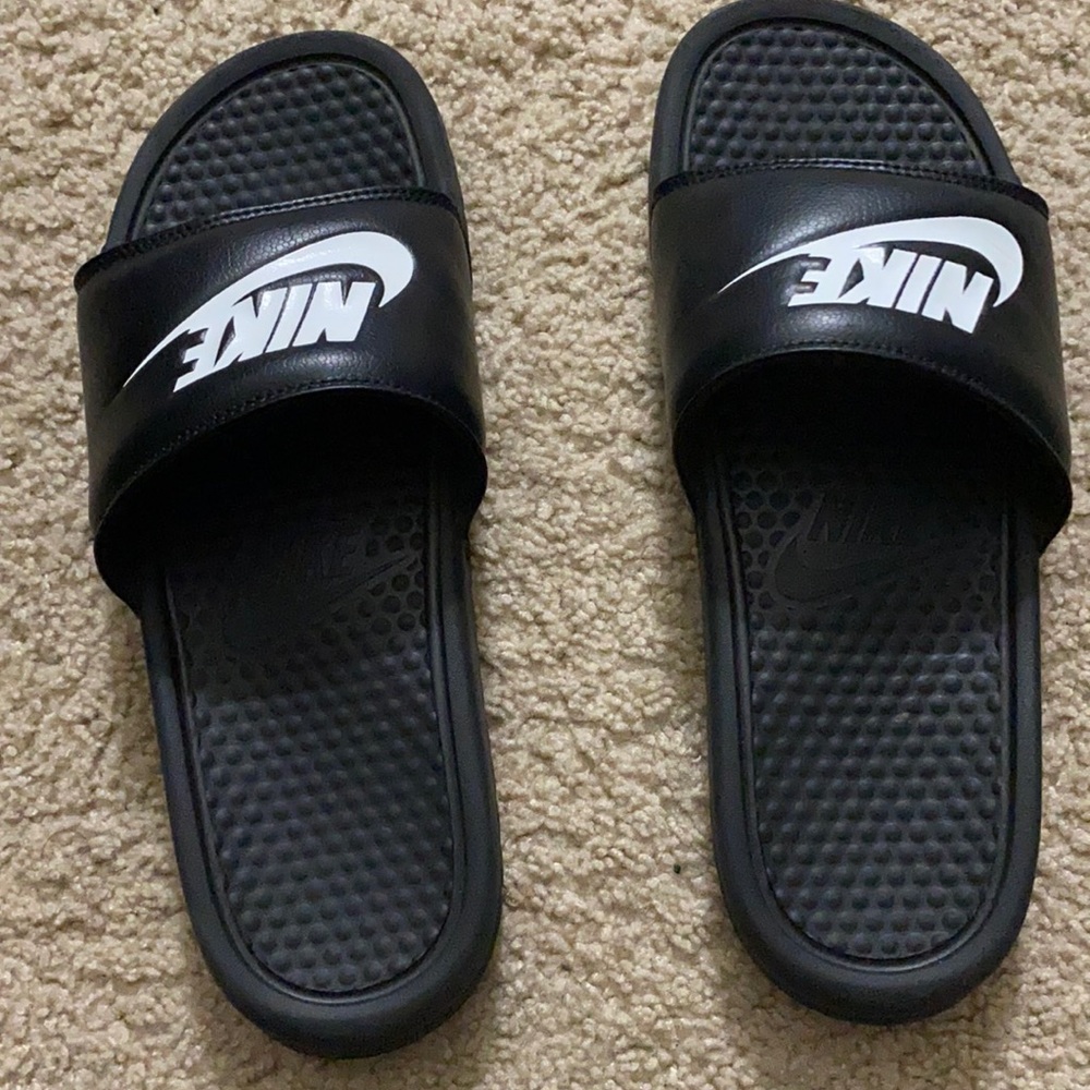 Black Nike slides , size 9.0 used only a couple times